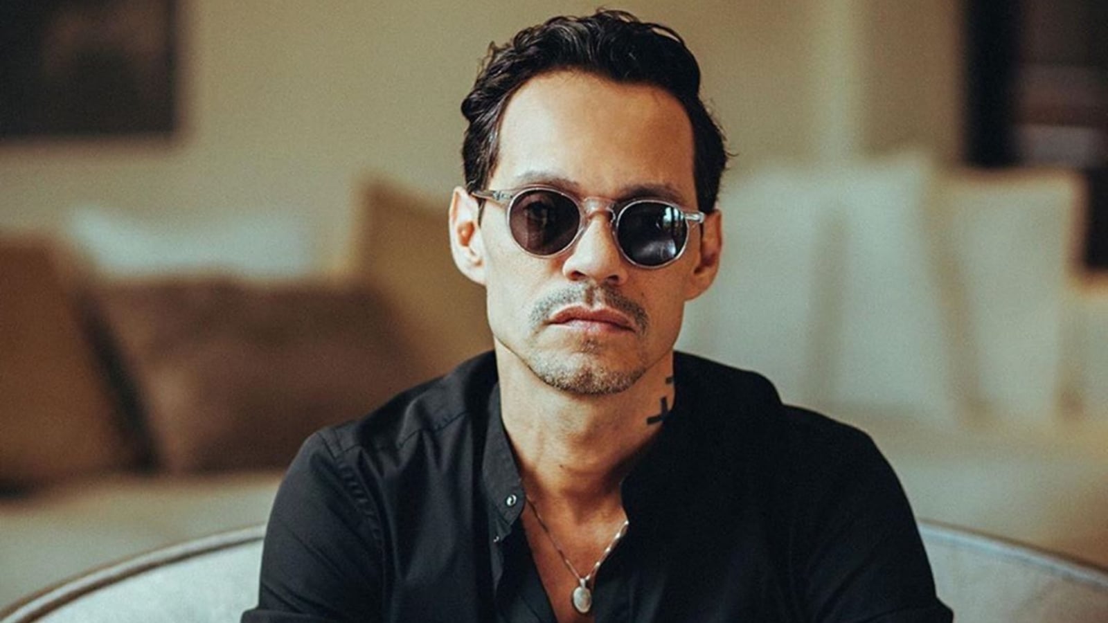 marc_anthony_lentes_oscuros