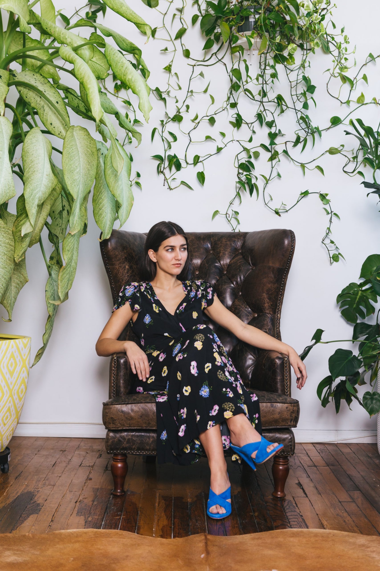 woman-sitting-in-a-chair-with-plants-around-her-Unsplash-scaled
