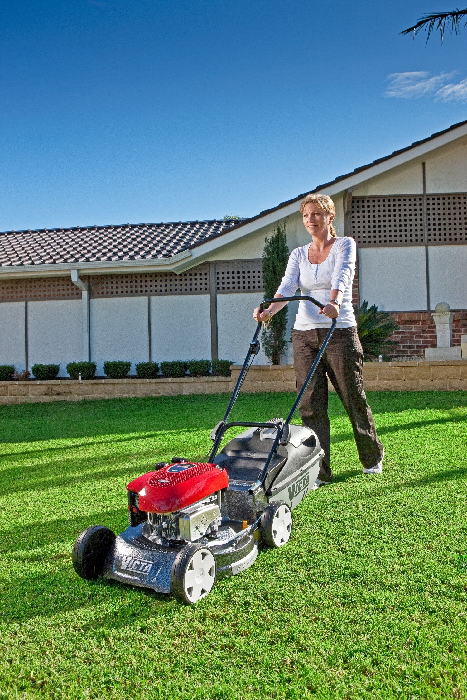 woman_mowing_lawn_1_1498_x_2246-zd0t5k1vr9cpyv1icj2_t1880