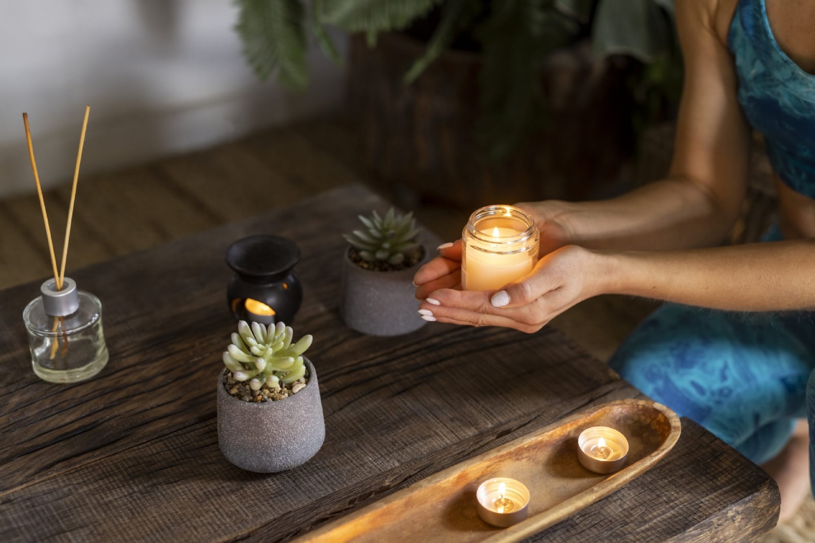 high-angle-woman-holding-candle-1-scaled