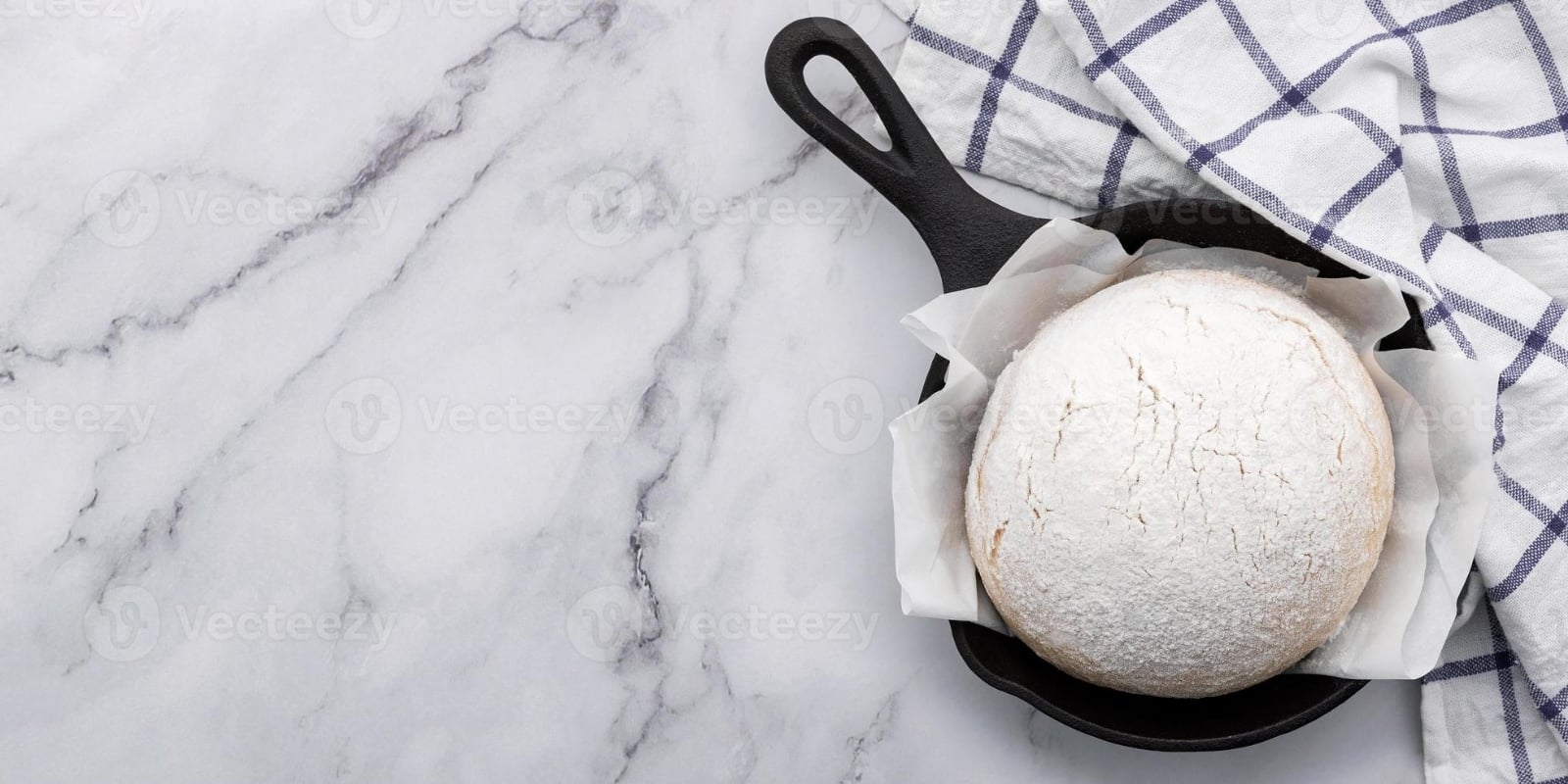 fresh-raw-homemade-yeast-dough-resting-in-cast-iron-skillet-photo