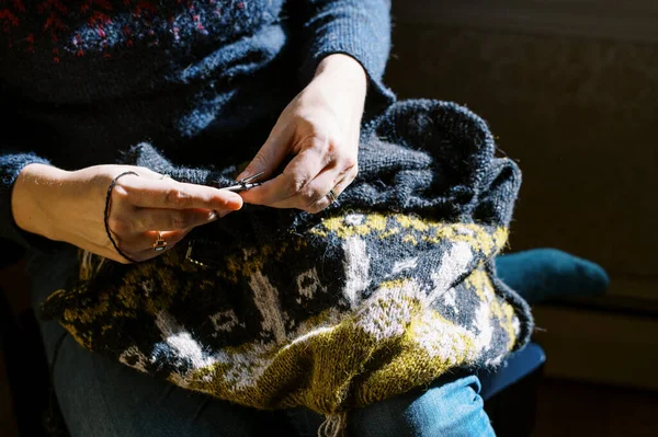 depositphotos_575389546-stock-photo-close-female-hands-knitting-sweater