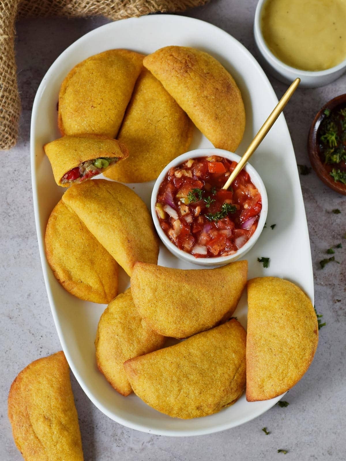 air-fryer-empanadas-with-homemade-salsa-on-white-plate