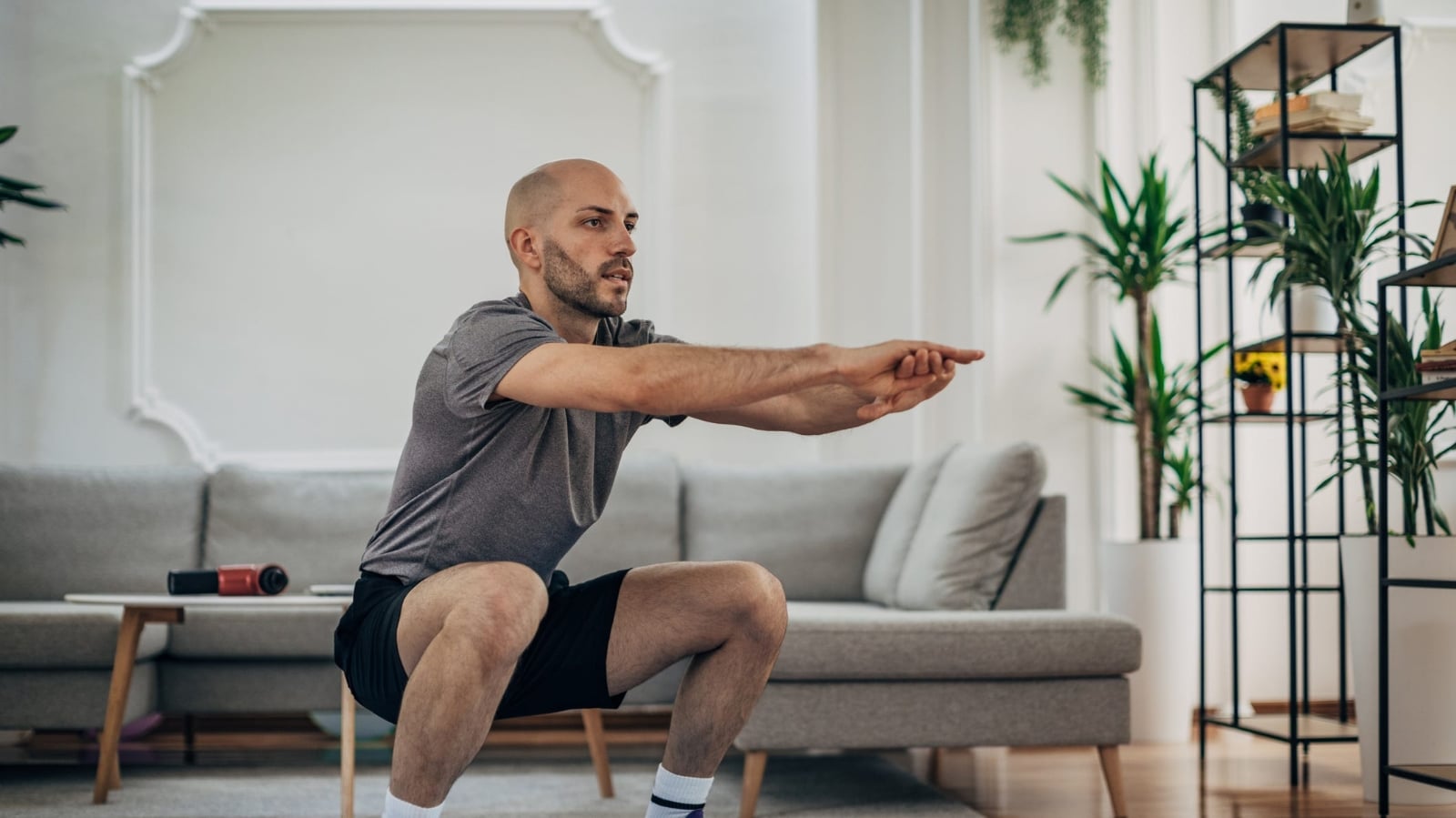 man-exercising-at-home-royalty-free-image-1669761449