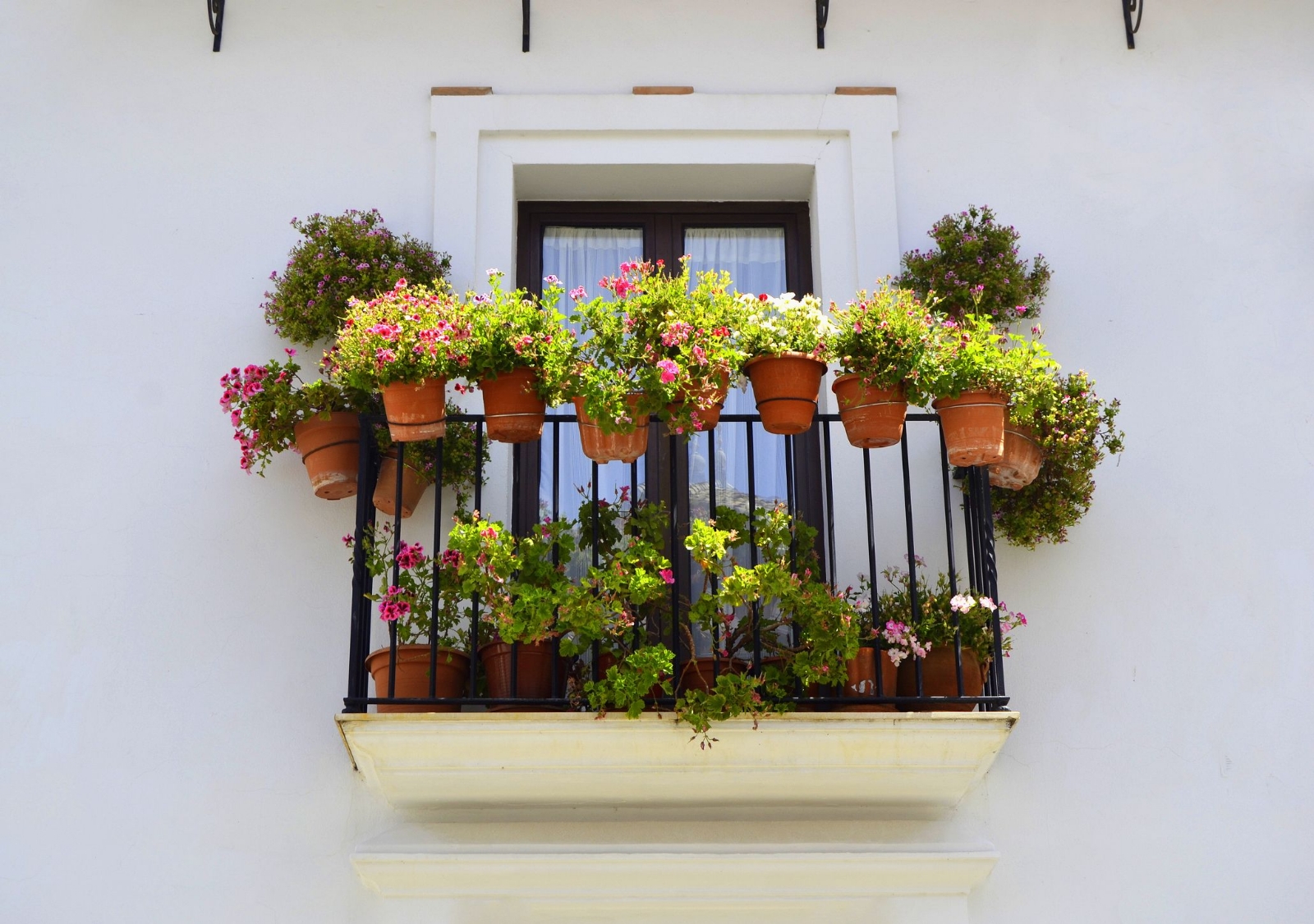 beautiful-balconies-with-typical-flowers-in-royalty-free-image-1587397919