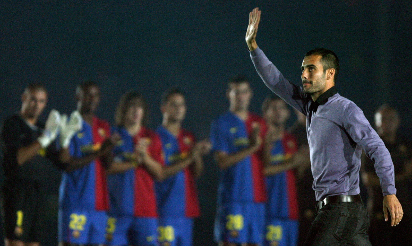 barcelonas-coach-josep-guardiola-waves