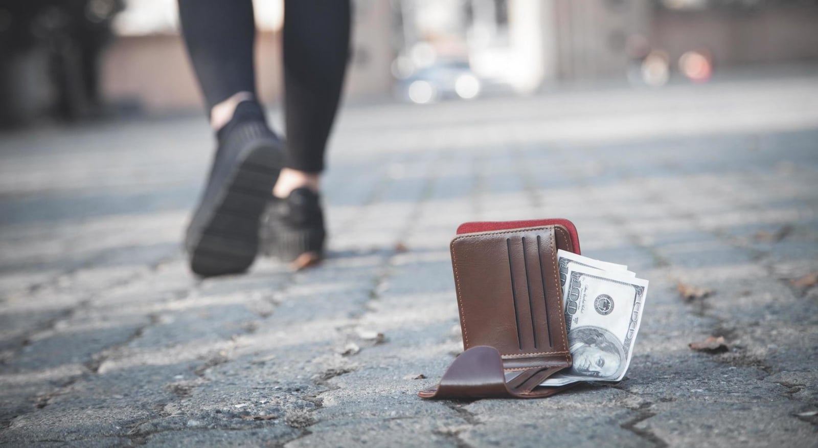 woman-lost-a-leather-wallet-with-money-on-the-park-free-photo